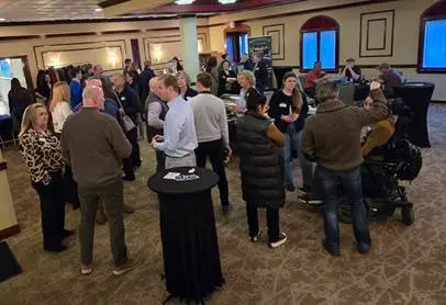 Community members talking at a local networking event