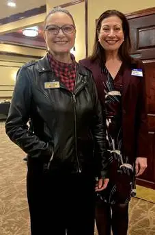 Two attendees at a community networking event